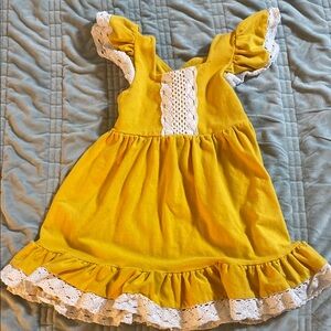 Mustard-colored sleeveless dress with winter white crochet trimming fits size 4T